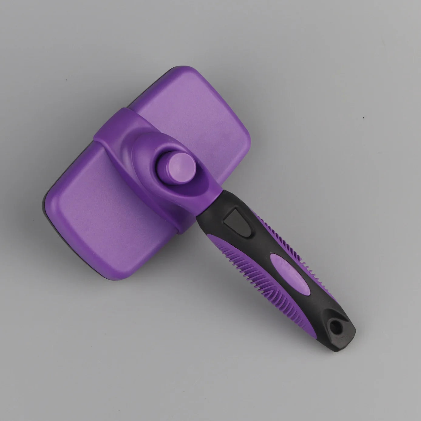 Brosse autonettoyante pour poils d'animaux